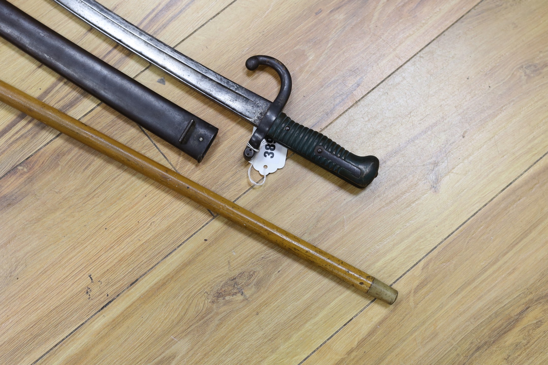 A silver mounted malacca walking cane together with a 19th century French bayonet